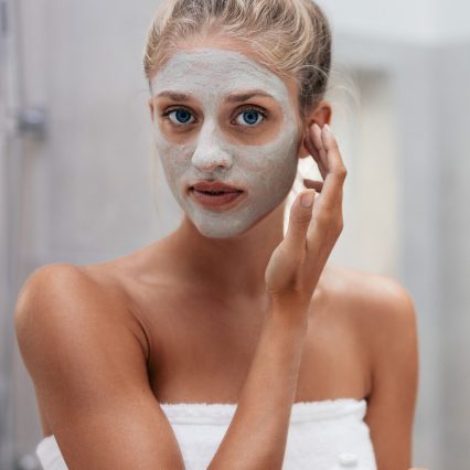 woman-applying-facial-mask-in-bathroom-2021-04-06-08-43-26-utc.jpg